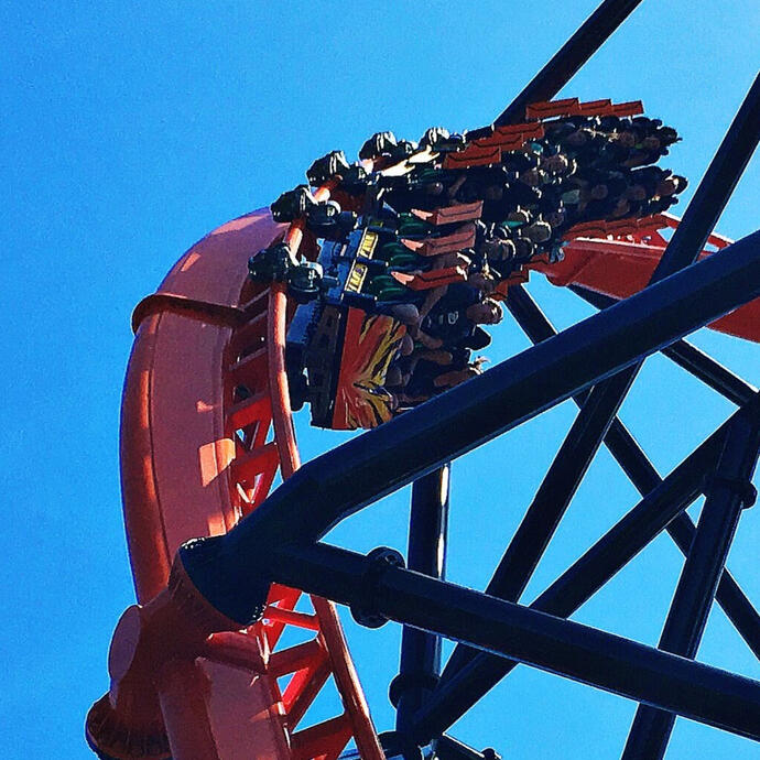 Orange launched roller coaster train